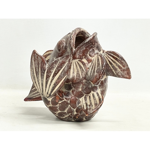 140 - A vintage oriental terracotta fish. 18x18cm.