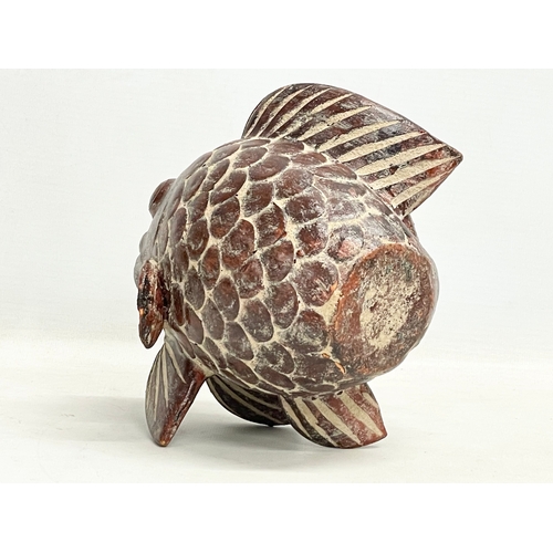 140 - A vintage oriental terracotta fish. 18x18cm.