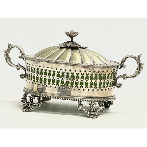 141 - A Victorian ornate pierced silver plated butter dish with green opaline glass. 21x11x11cm