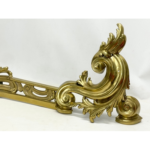 25 - An early 20th century French Louis XV 18th century style Rococo brass fender. 151x35cm