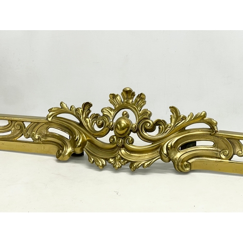 25 - An early 20th century French Louis XV 18th century style Rococo brass fender. 151x35cm