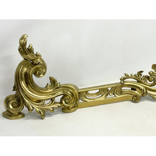 25 - An early 20th century French Louis XV 18th century style Rococo brass fender. 151x35cm