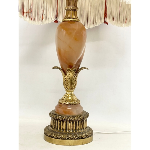 164 - A large vintage ornate brass and onyx table lamp. Base measures 68cm. 97cm including shade.