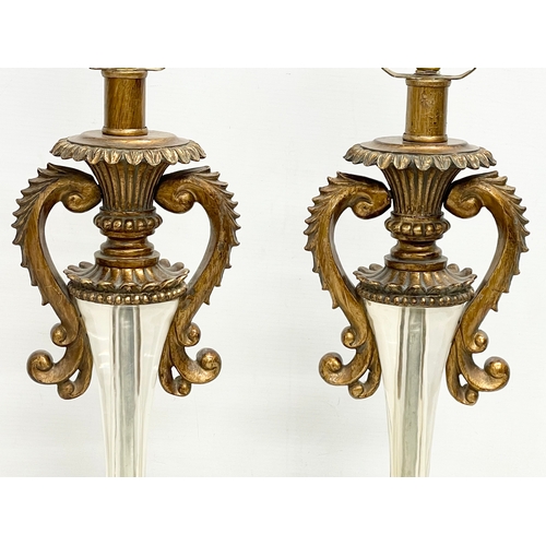 174 - A pair of ornate gilt table lamps. 66cm