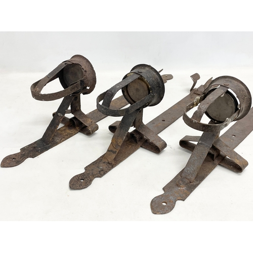 190 - 3 large 19th century iron wall hanging candleholders. 64cm