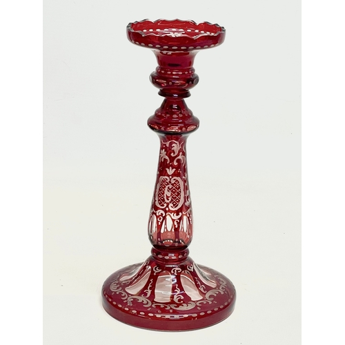 268 - 3 pieces of 19th century Ruby Glass. Bohemian Glass candlestick 23cm. A Victorian sweet jar with lid... 