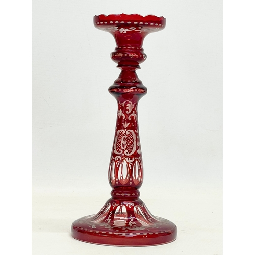 268 - 3 pieces of 19th century Ruby Glass. Bohemian Glass candlestick 23cm. A Victorian sweet jar with lid... 