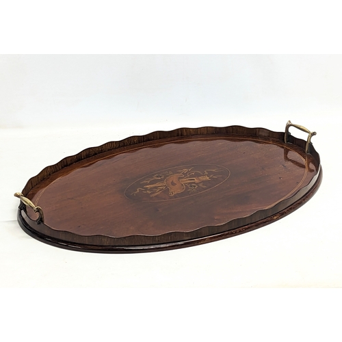 195 - An Edwardian inlaid mahogany serving tray with brass handles. 63x43.5cm