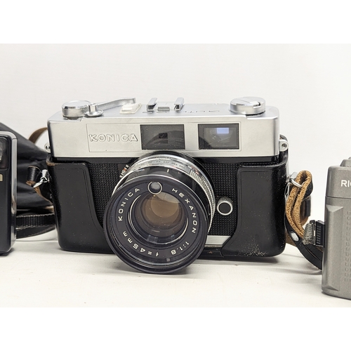 245 - A collection of cameras, including a Konica Auto S2 35mm Camera, Kodak Brownie Twin 20 Camera, Konic... 