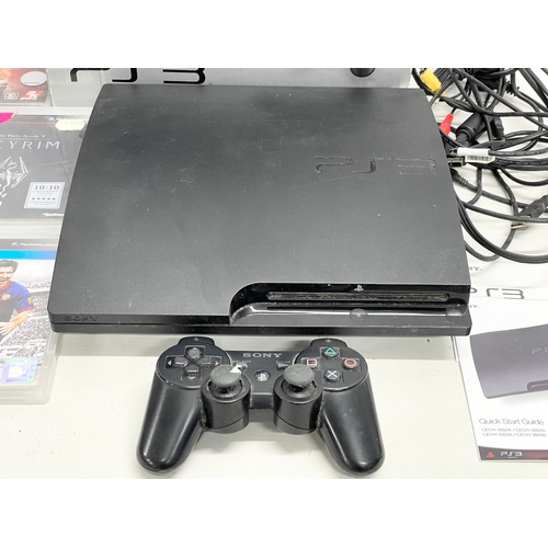 246 - A PlayStation 3 (PS3) in box with controller, leads and games.