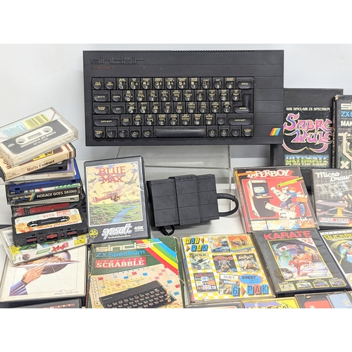 251 - A vintage Sinclair ZX Spectrum Plus keyboard with games, etc.