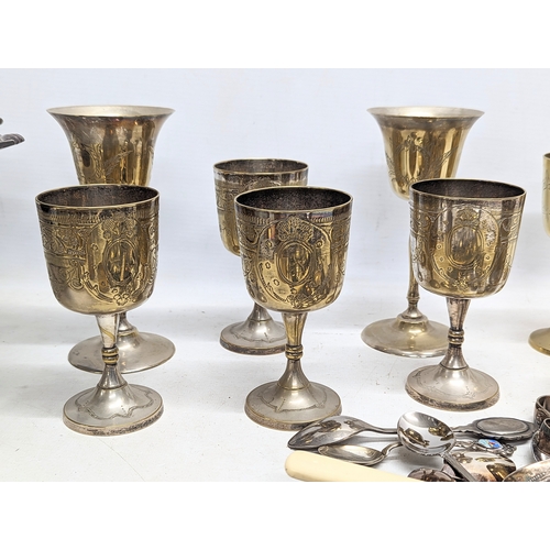 574 - A quantity of silver plate, including cutlery, drinking goblets, napkin rings, etc.