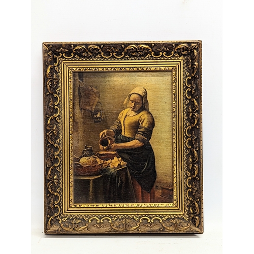 578 - A vintage oleograph of Jan Vermeer Van Delft's 'The Milkmaid,' in ornate gilt frame. 28x33.5cm with ... 