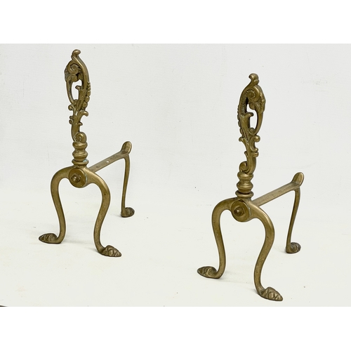 253 - Early 20th century brass andirons and fire stools.