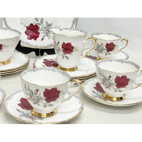 581 - A 21 piece Royal Stafford ‘Roses to Remember’ tea set.