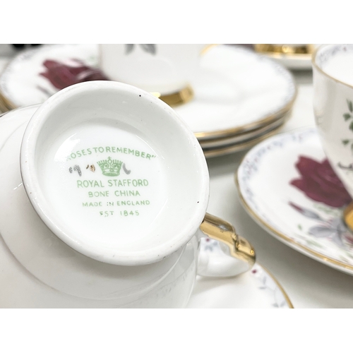 581 - A 21 piece Royal Stafford ‘Roses to Remember’ tea set.