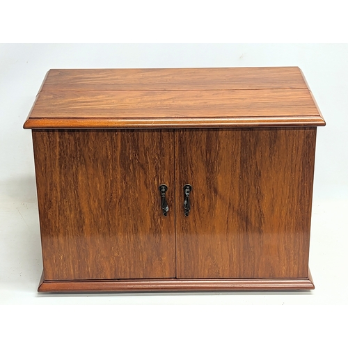 60C - A walnut tabletop drinks cabinet. 61x34.5x42cm