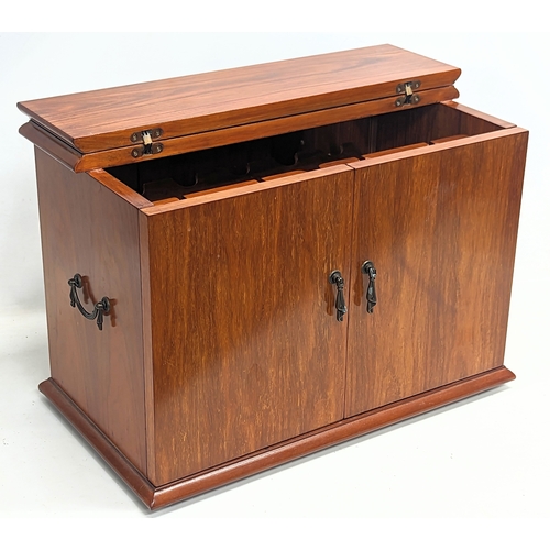 60C - A walnut tabletop drinks cabinet. 61x34.5x42cm