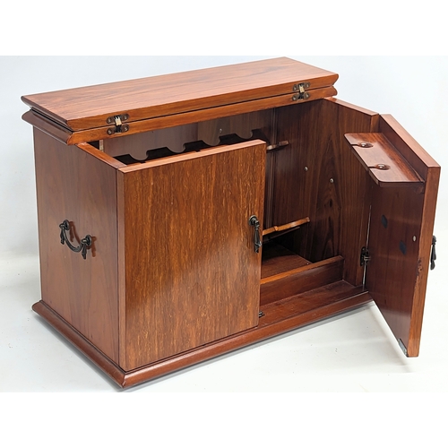 60C - A walnut tabletop drinks cabinet. 61x34.5x42cm