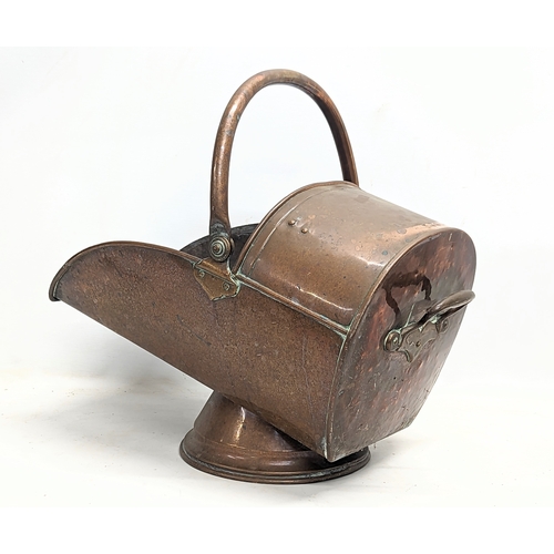 30D - A Victorian copper coal scuttle. 31x53x47cm