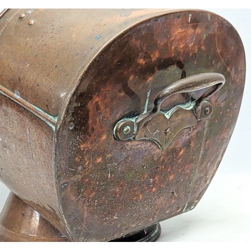 30D - A Victorian copper coal scuttle. 31x53x47cm