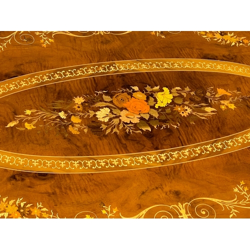 1009 - An Italian hand inlaid coffee table. 120x73x48cm