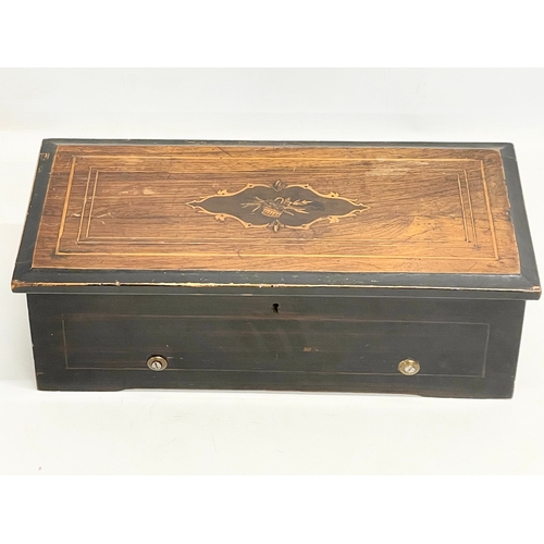 30M - A Victorian inlaid rosewood music box. 42x20x12.5cm