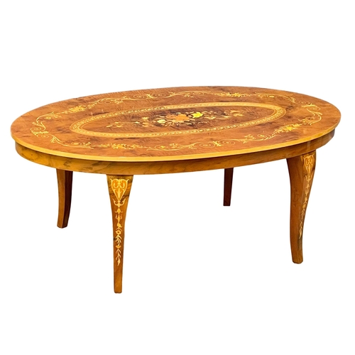 1009 - An Italian hand inlaid coffee table. 120x73x48cm