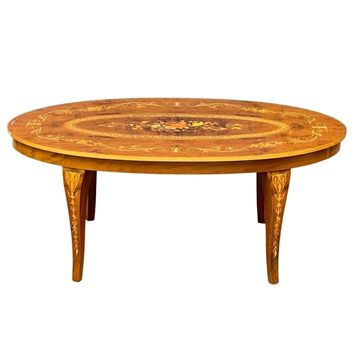 1009 - An Italian hand inlaid coffee table. 120x73x48cm