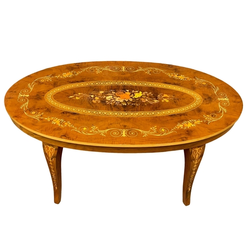 1009 - An Italian hand inlaid coffee table. 120x73x48cm