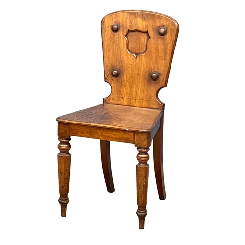 1010 - A Victorian mahogany hall chair.