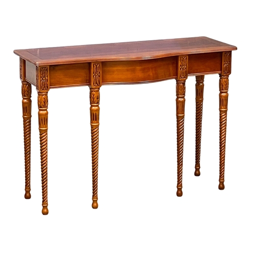 1011 - A mahogany serpentine console table with drawer. 107x40x76cm