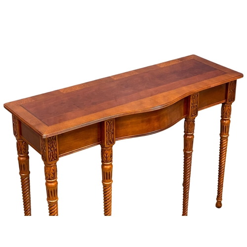 1011 - A mahogany serpentine console table with drawer. 107x40x76cm