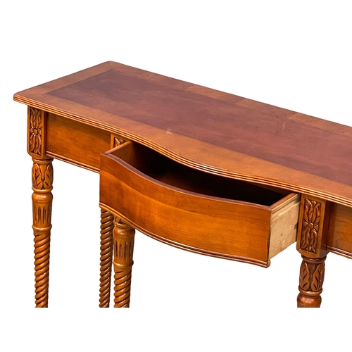 1011 - A mahogany serpentine console table with drawer. 107x40x76cm