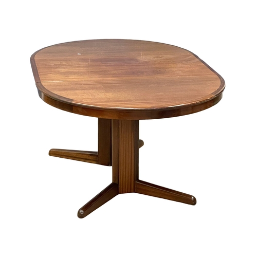 1012 - A Danish Mid Century extending dining table designed by Niels Kofoed for Kofoed Hornslet. Open 156x1... 