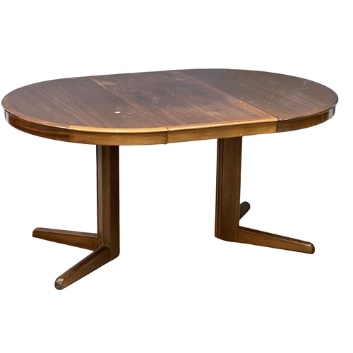 1012 - A Danish Mid Century extending dining table designed by Niels Kofoed for Kofoed Hornslet. Open 156x1... 