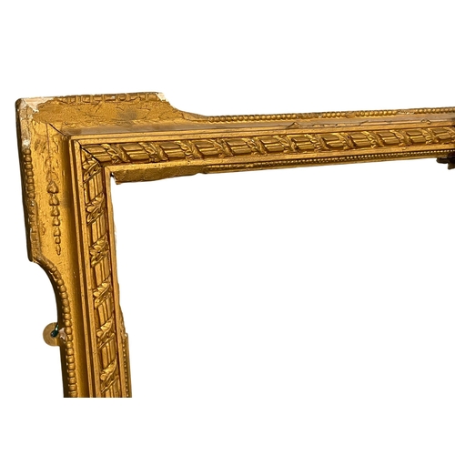 105D - A large Victorian gilt framed over mantle mirror. 127x97cm