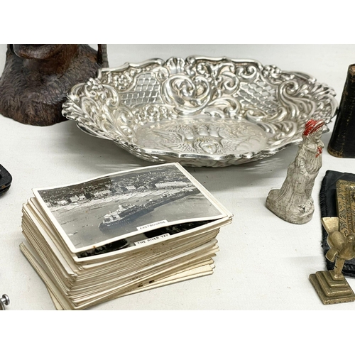 584 - A sundry lot. A small silver mounted prayer book. A collection of Senior Service cigarette postcards... 