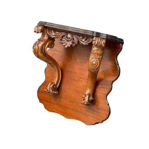 60A - A large Victorian carved mahogany wall bracket. 71x33x75cm