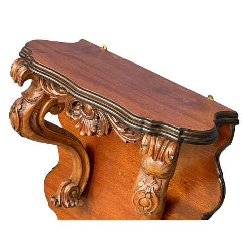 60A - A large Victorian carved mahogany wall bracket. 71x33x75cm