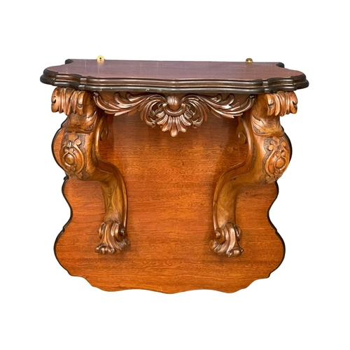 60A - A large Victorian carved mahogany wall bracket. 71x33x75cm