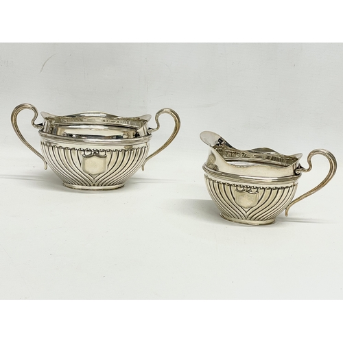 14 - A 5 piece silver plated tea service. Including a spirit kettle 23x30cm. A coffee pot 24.5x24cm. Teap... 