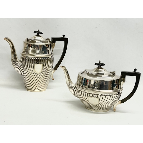 14 - A 5 piece silver plated tea service. Including a spirit kettle 23x30cm. A coffee pot 24.5x24cm. Teap... 