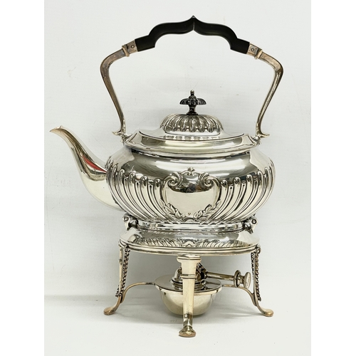 14 - A 5 piece silver plated tea service. Including a spirit kettle 23x30cm. A coffee pot 24.5x24cm. Teap... 