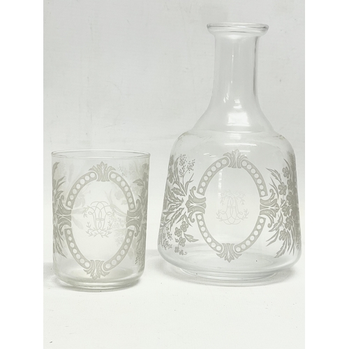 15 - A pair of Victorian etched glass carafe’s and matching cups, with an early 20th century carafe and c... 