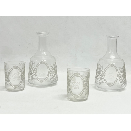 15 - A pair of Victorian etched glass carafe’s and matching cups, with an early 20th century carafe and c... 