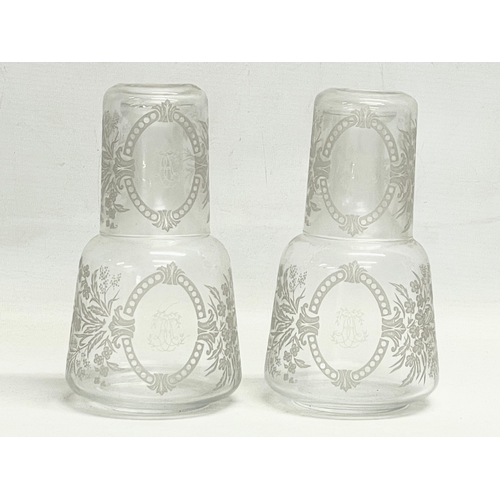 15 - A pair of Victorian etched glass carafe’s and matching cups, with an early 20th century carafe and c... 