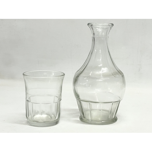 15 - A pair of Victorian etched glass carafe’s and matching cups, with an early 20th century carafe and c... 