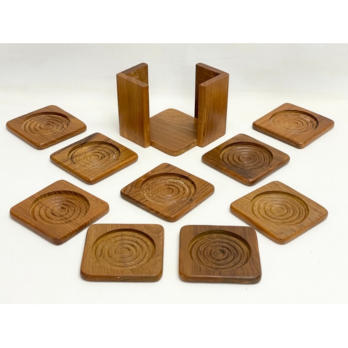 18 - A collection of Mid Century kitchenware. Teak coasters and stand, pig cocktail, double sided tray, 2... 