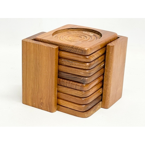 18 - A collection of Mid Century kitchenware. Teak coasters and stand, pig cocktail, double sided tray, 2... 